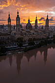 Aerial view of El Pilar Basilica Cathedral and the Ebro River at sunset, Zaragoza, Spain