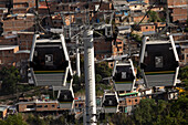 The famous metro system in Medellin, Colombia.includes elevated traiins, street level trains and even aerial cable cars to connectthe city's downtown to the poorer neighborhoods in the surrounding mountains.