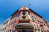 Teatro Nazionale building facade in Rome with clear blue sky.