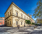 Seville, Spain, Jan 28 2021, View of the historic Ayuntamiento building in Plaza Nueva, Sevilla, Spain. The architecture reflects classical Renaissance style with vibrant city life in the surrounding area.