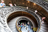 Rome, Italy, July 22 2017, Visitors descend the elegant helicoidal staircase at the Vatican Museums in Rome, showcasing stunning architectural design and detail.