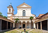 Rome, Italy, July 22 2017, Explore the serene cloister of San Clemente basilica, featuring a charming courtyard and fountain under the warm Roman sun.