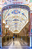 Rome, Italy, July 22 2017, Visitors explore the stunning first floor galleries of the Vatican Museums, immersed in historic art and architecture.