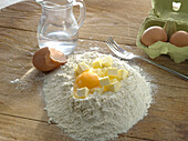 Ingredients for quiche dough: flour, butter, egg, water