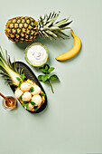 Pineapple ice cream with yoghurt, banana and mint