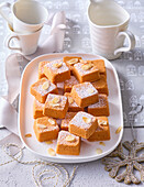 Christmas carrot cake bites with almonds and icing sugar