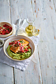 Honey-glazed salmon with avocado cream and tomato salsa