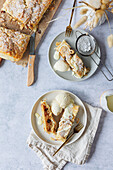 Apple strudel made from puff pastry with vanilla ice cream and vanilla sauce