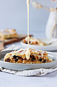 Apple strudel made from puff pastry with vanilla sauce