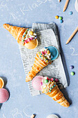 Puff pastry school cone with cream and sweets