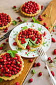 Pistachio tartlets with wild strawberries
