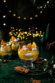 Christmas dessert made from quark cream with orange pudding and speculaas biscuits