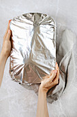 Cover the oven dish with aluminium foil