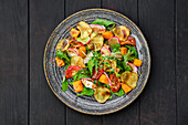 Autumn salad with radishes, pumpkin and pear