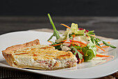 Quiche with ham and side salad