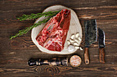 Raw beef shank with garlic and rosemary