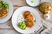 Celery and potato pancakes with yoghurt dip and salad
