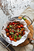 Roasted tomatoes with pine nuts and basil