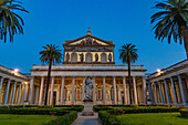 The statue of St. Paul and facade of the Basilica of St. Paul Outside the Walls, Rome, Italy.