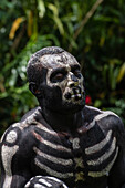 The Skeleton Men from the Omo Bugamo tribe of Papua New Guinea paint their bodies with black and white paint emulating the human skeleton, Chimbu Province, Papua New Guinea