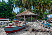 Wrecked boats next to the plage de Ti Mouillage beach in Cayes-de-Jacmel, Cayes de Jacmel, Jacmel, Haiti.