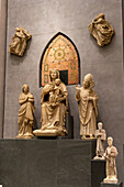 Sculptures by Arnolfo di Cambio in the Duomo in the Duomo Museum in Florence, Italy. L-R: Santa Reparata, Mary in Majesty, & Saint Zanobi. Behind is the Backrest of Mary's Throne and two Angels Lifting Curtains.