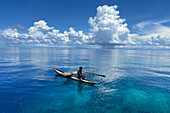 Resident of Vitu Islands in their traditional dugout canoes, Lama Anchorage, New Britain, Papua New Guinea