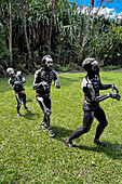 The Skeleton Men from the Omo Bugamo tribe of Papua New Guinea paint their bodies with black and white paint emulating the human skeleton, Chimbu Province, Papua New Guinea