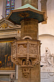 The marble pulpit carved in 1480 by Benedetto da Maiano in the Basilica of Santa Croce in Florence, Italy.