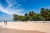 Children playing in the beach on Cayes-à-L’eau, a fishermen islet located northeast of Caye Grand Gosie, Île-à-Vache, Sud Province, Haiti