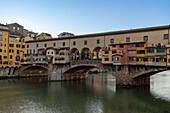 The Ponte Vecchio, a medieval stone arch bridge over the Arno in Florence, Italy.