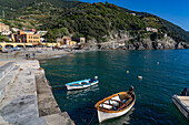 Two small fishing boats in the harbor of Monterosso al Mare, Cinque Terre, Italy.