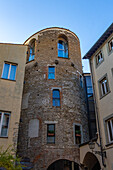 The medieval tower called the Torre Pagliazza was first built as a storage granary in Florence, Italy. It later became a women's prison and is now part of the Hotel Brunelleschi with a restaurant on its ground floor.