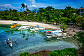 Traditional boats moored in Logon beach, Malapascua island, Cebu, Philippines