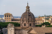 Dome of the Church of Saints Luca and Martina, located in the Roman Forum in Rome, Italy. At right is Trajan's Column topped by a statue of St. Peter.