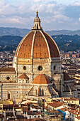 View of the Duomo or Cathedral of Santa Maria del Fiore from the Palazzo Vecchio tower in Florence, Italy.