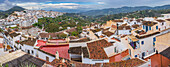 Frigiliana village in Andalusia with traditional houses, tiled rooftops, and stunning scenery.