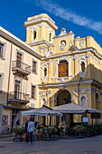 Outdoor restaurant in front of the Sanctuary of the Madonna del Carmine in Sorrento, Italy.