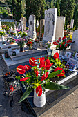 Flowers decorate the graves in a cemetery in Anacapri on the island of Capri, Italy.