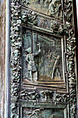 Detail of the right portal door of the Duomo of Pisa. Cast in bronze in 1605 by Giambologna. Pisa, Italy. Depicted is the mocking of Christ with the crown of thorns.