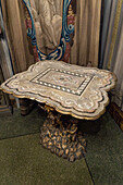 A sculpted marble table with a Florentine mosaic marble top in the Palazzo Medici Riccardi, Florence, Italy.