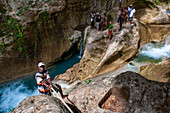 Exploring the cobalt waters of Bassin Bleu waterfall composed of bassin yes, bassin palmiste and bassin clair, Maire de Jacmel, Jacmel, Haiti