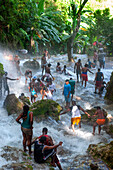 Haiti Voodoo Festival in Saut d'Eau, in Saut d'Eau, Ville Bonheur, Haiti. Thousands of both Vodou and Catholic followers gathered under the Saut d'Eau waterfall in Haiti. The pilgrimage, made by Voodou practitioners and Catholics alike, originated with the sighting of the likeness of the Virgin Mary on a palm leaf close to the falls half a century ago. Catholism and Voodou practices are forever intertwined in its Haitian form. The appearance of a rainbow beneath the falls is said indicate that Danbala - the great lord of the waterfall - and Ayida Wedo - the rainbow - are making love. Fertility