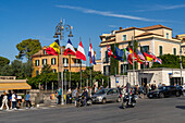 International flags on the Piazza Tasso in the historic center of Sorrento, Italy.