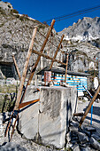 An antique wooden hand saw for cutting blocks of marble in the quarry. Fantiscritti Quarry Museum, Carrara, Italy.