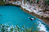 Exploring the cobalt waters of Bassin Bleu waterfall composed of bassin yes, bassin palmiste and bassin clair, Maire de Jacmel, Jacmel, Haiti