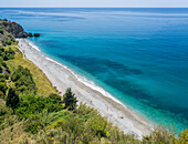 A tranquil coastal scene at Playa de la Caleta in Andalusia, Spain.