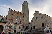 Facade of the Palazzo Comunale, Torre Grossa & Collegiata di Santa Maria Assunta Church. San Gimingnano, Italy.