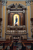 A statue of the Virgin Mary in a side chapel of the Church of San Francesco di'Assisi in Sorrento, Italy.