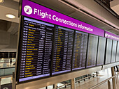 The flight connections information screen at Heathrow Airport, London, England.